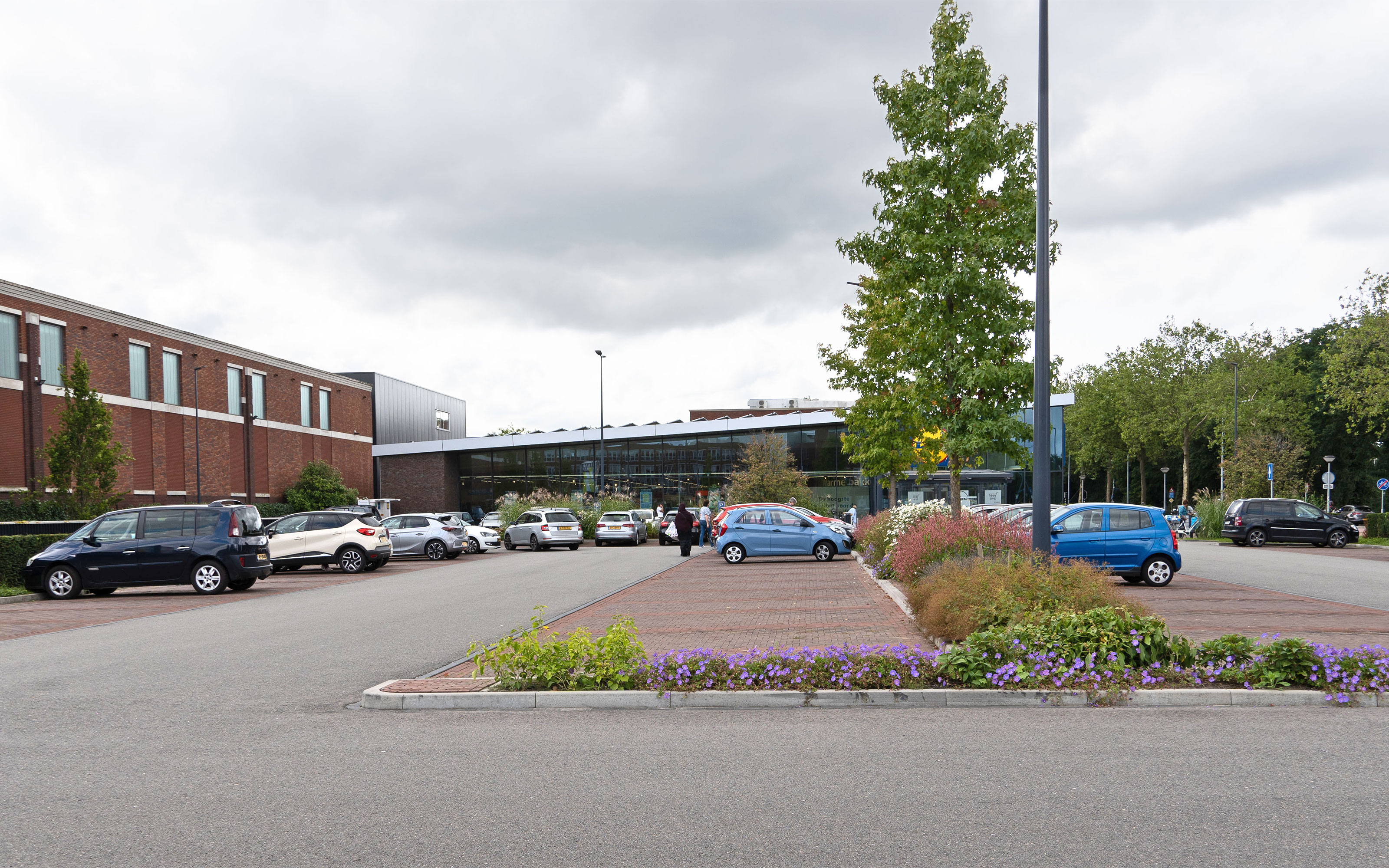 The outdoor parking area is situated on top of the concrete deck of the underground garage. Deck of an underground garage